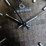 Macro shot of Vintage Mechanical Certina Mens Watch with stunning square textured dial.