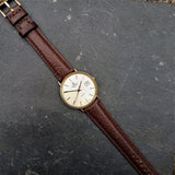 A beautiful yet classic vintage mens watch by Marvin with a supple brown leather strap