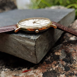 The crown on the case of a stunning condition vintage Marvin Revue Mens Gold Plated watch from the 1970s.