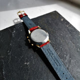Rear of red leather crocodile strap on vintage chronograph watch
