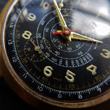 Macro Shot of Vintage 1950s Cimier Sport Gold Mechanical Chronograph with Black Leather Strap with Red Stitching 